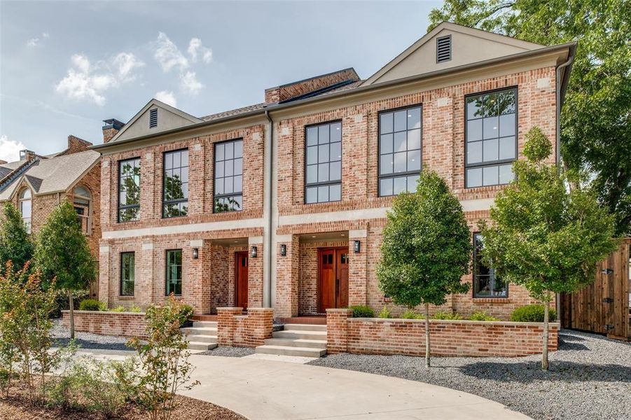 Classic drive-up appeal, with custom landscaping and a circular driveway for easy access. Classic drive-up appeal, with custom landscaping and a circular driveway for easy access.
