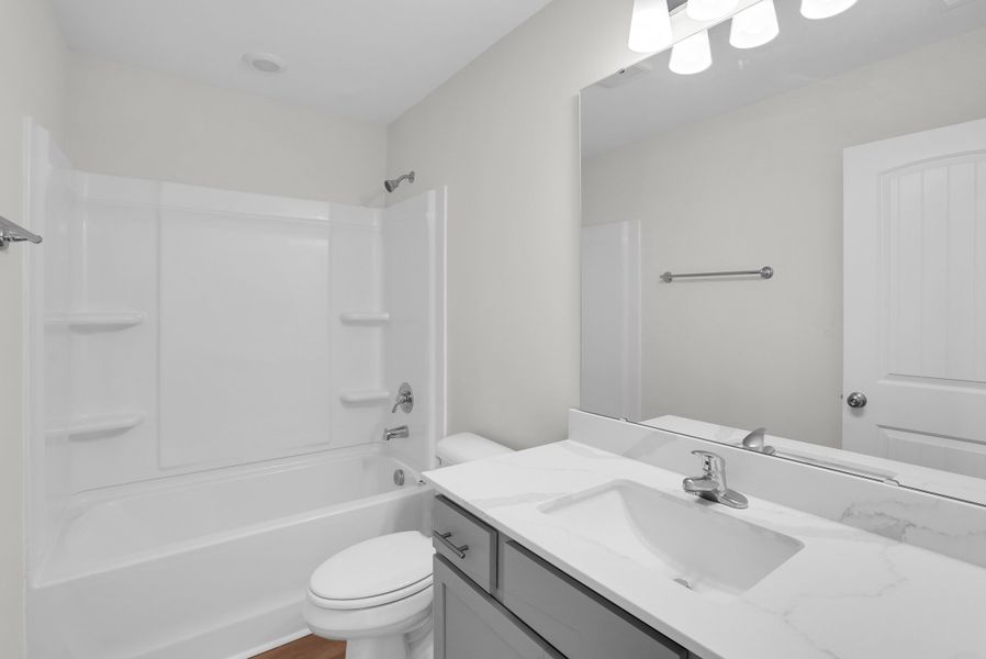 Representative furnished interior of a home built from the The Aspen by Smith Family Homes in Sweetwater, Brunswick (Image 12).