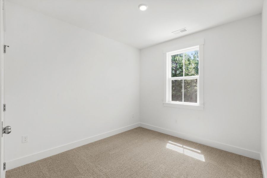 Spacious, unfurnished interior of a new home in Long Bay Golf Club, Longs (Image 35).