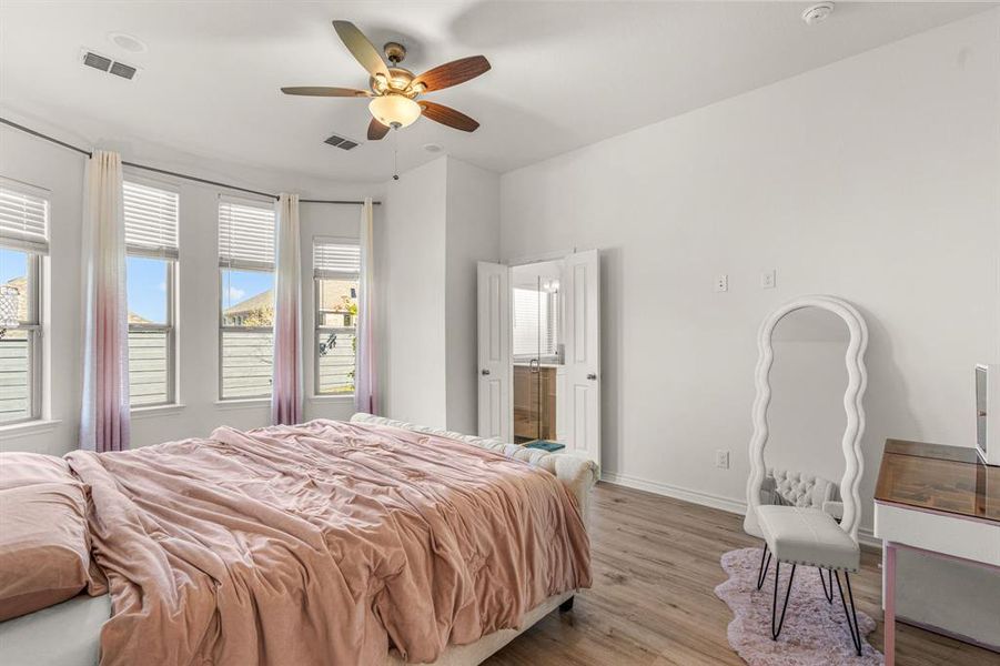 Bedroom featuring ceiling fan and light hardwood / wood-style floors