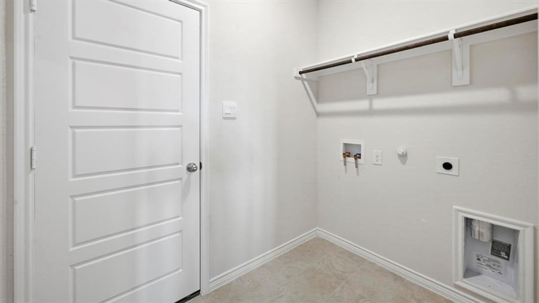 Laundry area featuring hookup for a gas dryer, hookup for a washing machine, and electric dryer hookup