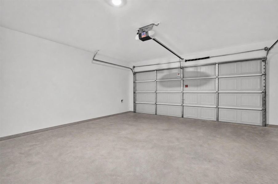 Spacious two-car garage offering ample room for vehicles, storage, and everyday household needs.