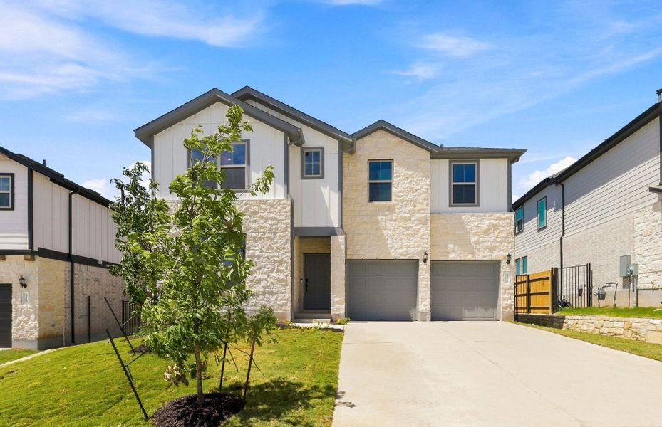 Front exterior of a new home in Saddleback at Santa Rita Ranch, Liberty Hill, TX, highlighting curb appeal (Image 23).