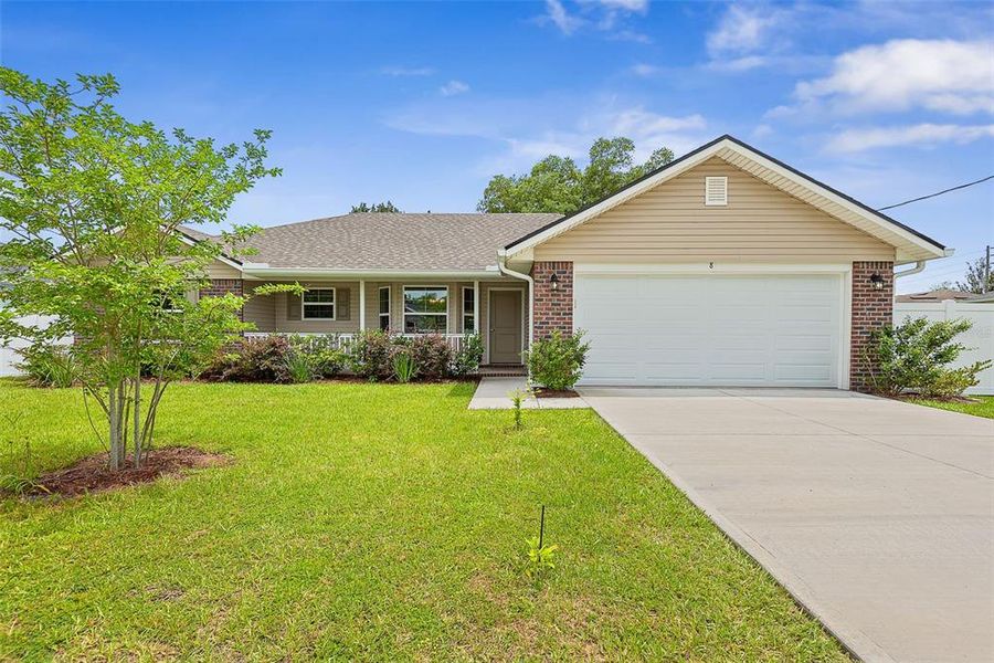 Front exterior of a new home in Palm Coast, Palm Coast, FL, highlighting curb appeal (Image 19).