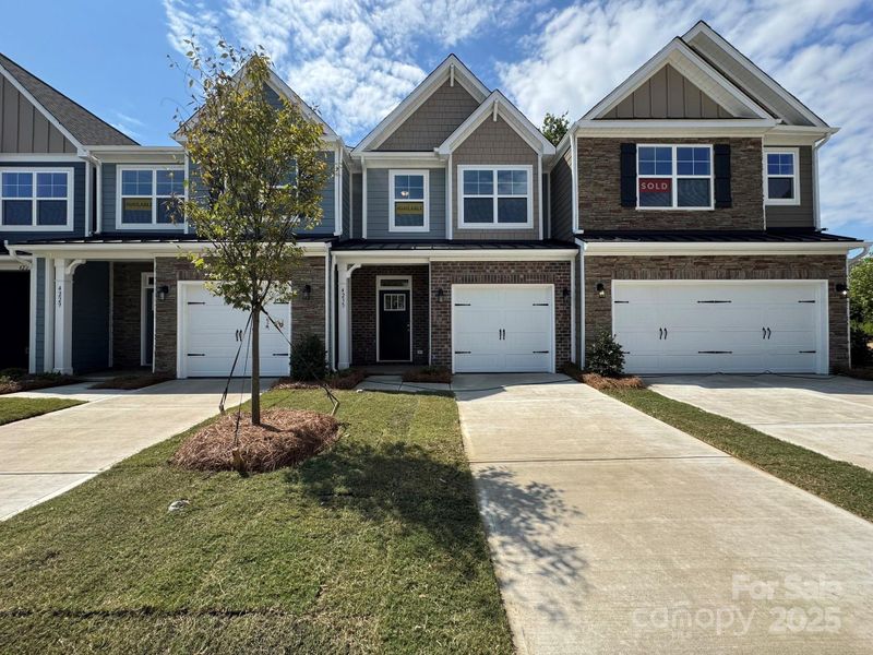 Front exterior of a new home in Harrisburg Village, Harrisburg, NC, highlighting curb appeal (Image 1).