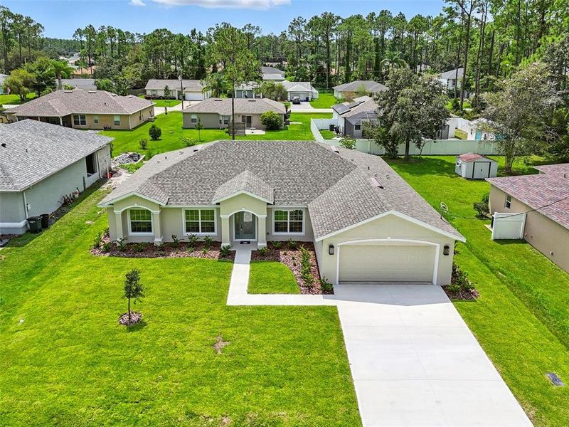 Front exterior of a new home in , Palm Coast, FL, highlighting curb appeal (Image 27).