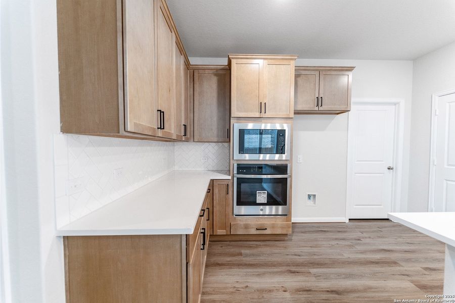 Furnished interior view inside a new home in The Woodlands at Medina Hills, Mico (Image 10).