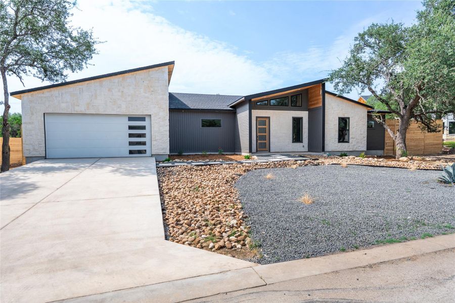 Front exterior of a new home in , Wimberley, TX, highlighting curb appeal (Image 20). Front exterior of a new home in , Wimberley, TX, highlighting curb appeal (Image 20).