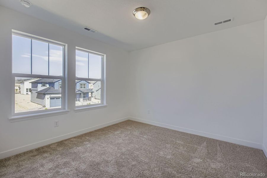 Spacious, unfurnished interior of a new home in Riano Ridge: The Grand Collection, Loveland (Image 11).