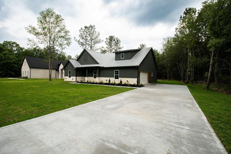 Front exterior of a new home in , Dayton, TX, highlighting curb appeal (Image 23).