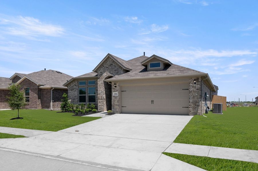 Front exterior of a new home in Terra Vella, Haslet, TX, highlighting curb appeal (Image 4).