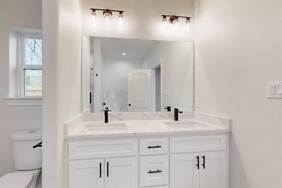 Bathroom with vanity and toilet