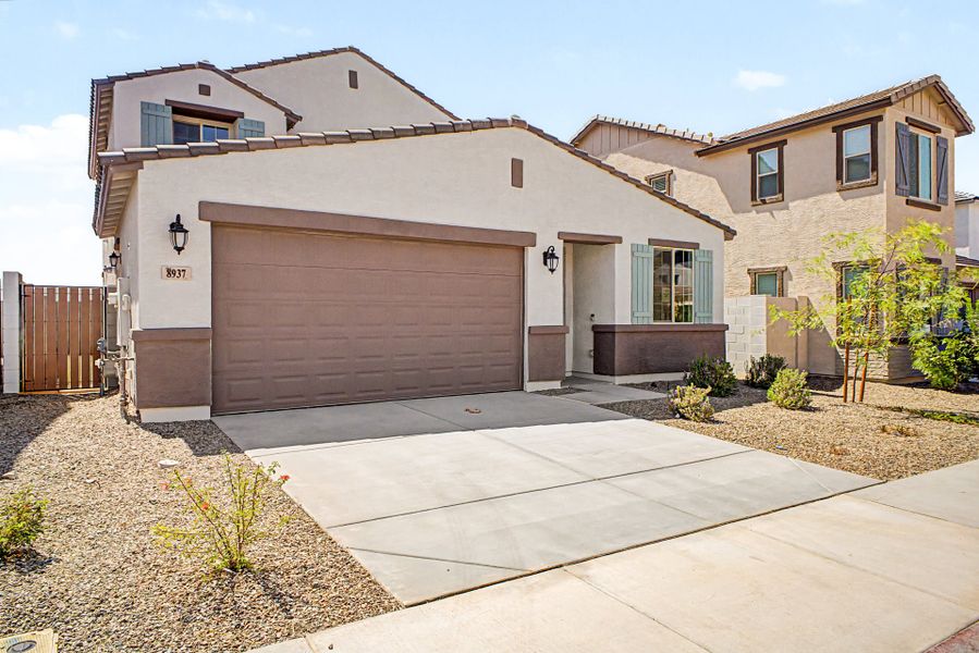 Front exterior of a new home in Rialta, Mesa, AZ, highlighting curb appeal (Image 2). Front exterior of a new home in Rialta, Mesa, AZ, highlighting curb appeal (Image 2).