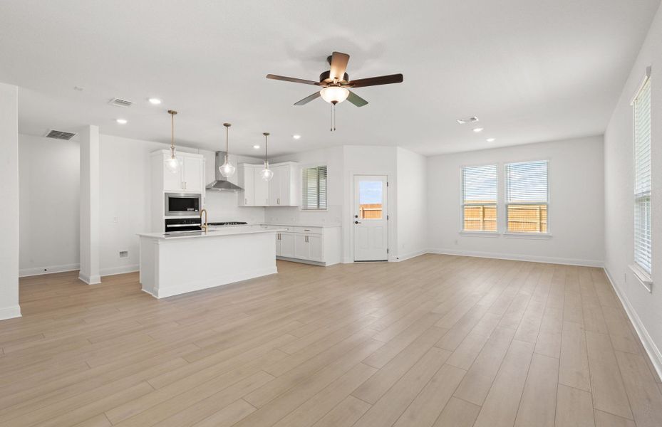 Representative unfurnished interior of a home built from the Orchard by Pulte Homes in Saddleback at Santa Rita Ranch, Liberty Hill (Image 10).