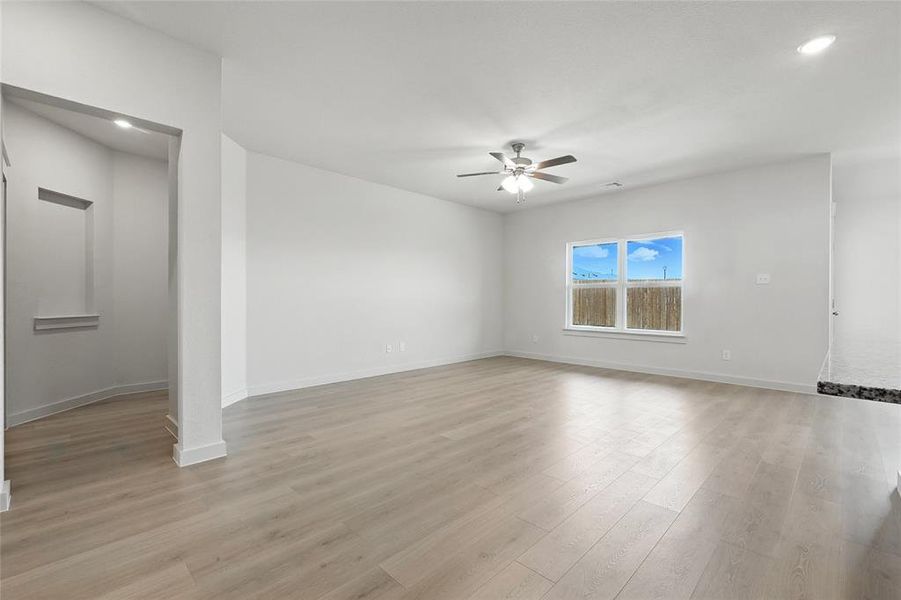Unfurnished room featuring light wood finished floors, ceiling fan, and recessed lighting Unfurnished room featuring light wood finished floors, ceiling fan, and recessed lighting