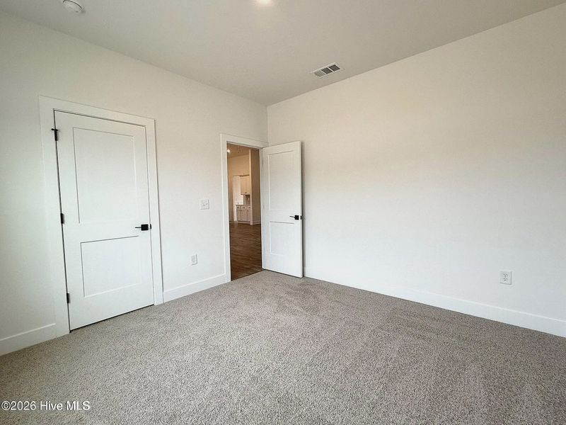 Spacious, unfurnished interior of a new home in Wood Creek Landing, Leland (Image 20). Spacious, unfurnished interior of a new home in Wood Creek Landing, Leland (Image 20).