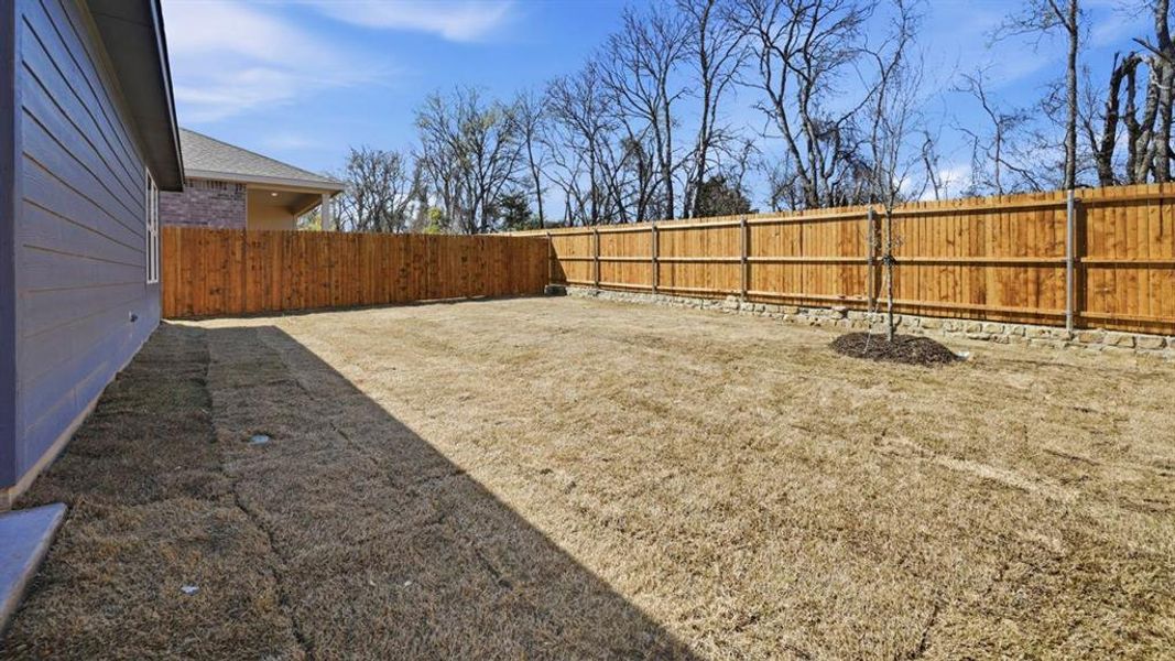 Exterior details and patio area of a home in Sweetwater Springs, Sherman (Image 3).