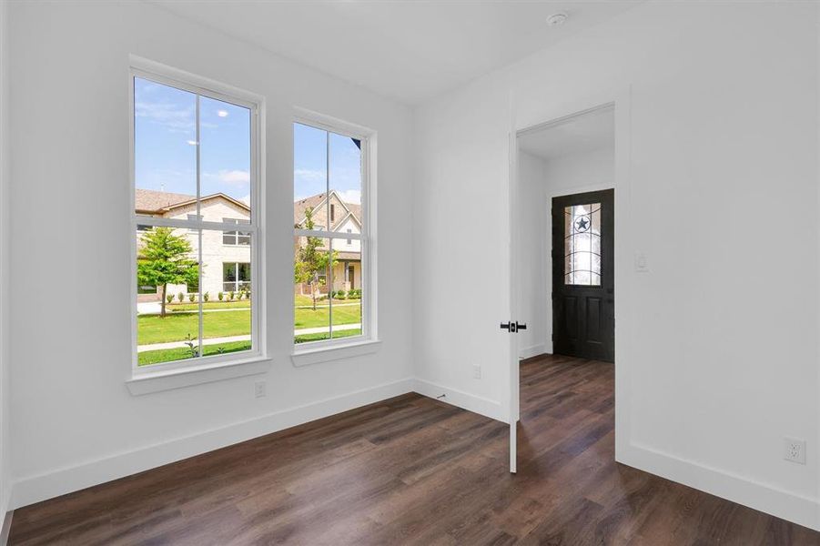 Office with dark wood-type flooring and a smoke detector Office with dark wood-type flooring and a smoke detector