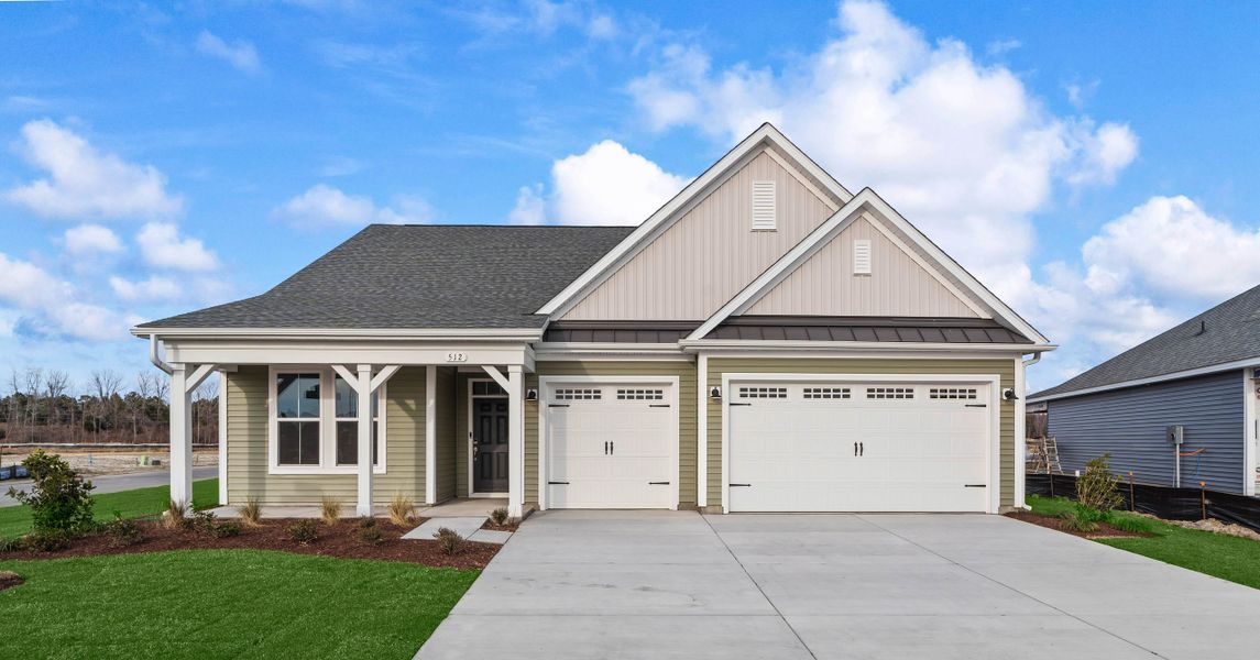 Front exterior of a new home in Traditions at Carolina Forest, Myrtle Beach, SC, highlighting curb appeal (Image 2). Front exterior of a new home in Traditions at Carolina Forest, Myrtle Beach, SC, highlighting curb appeal (Image 2).