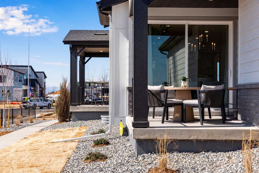 Exterior details and patio area of a home in Painted Prairie, Aurora (Image 20).