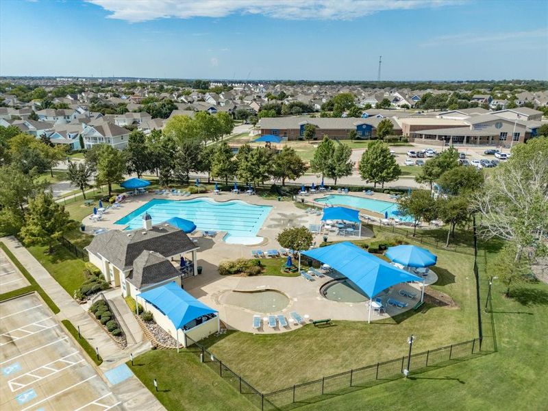 Aerial view of residential area with a pool area Aerial view of residential area with a pool area
