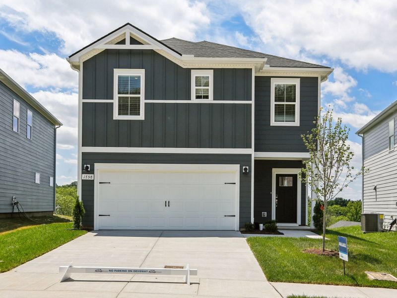 Front exterior of a new home in Crestview - Ridge Series, Hermitage, TN, highlighting curb appeal (Image 1). Front exterior of a new home in Crestview - Ridge Series, Hermitage, TN, highlighting curb appeal (Image 1).