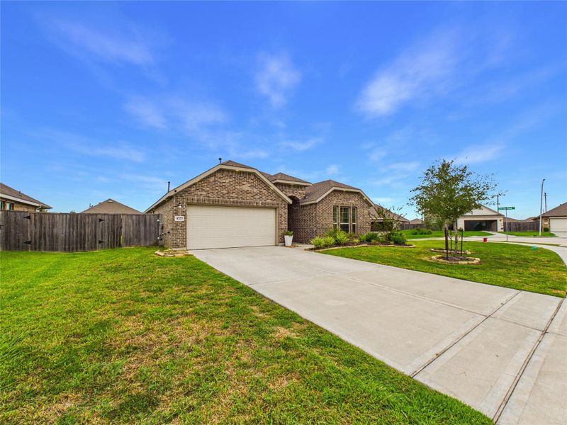 Front exterior of a new home in Sterling Point at Baytown Crossings: Wildflower II Collection, Baytown, TX, highlighting curb appeal (Image 2). Front exterior of a new home in Sterling Point at Baytown Crossings: Wildflower II Collection, Baytown, TX, highlighting curb appeal (Image 2).