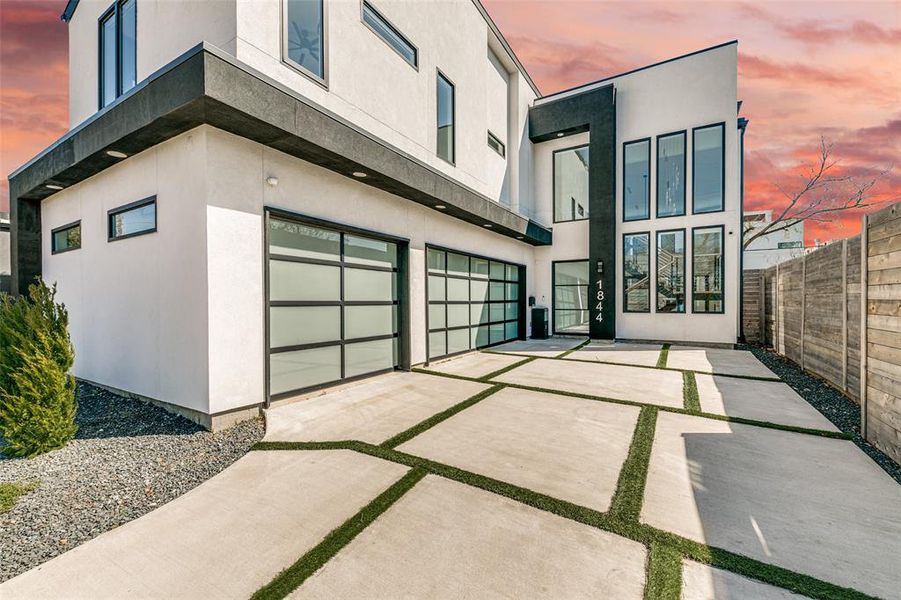 Front of house, driveway and 3 car garage