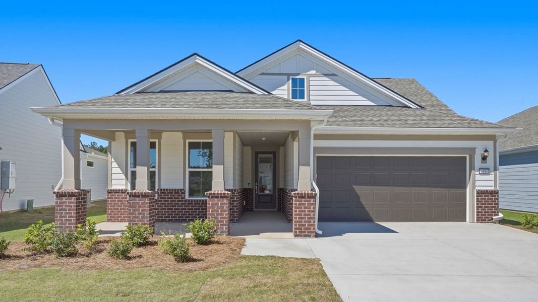 Front exterior of a new home in Sun City Hilton Head, Bluffton, SC, highlighting curb appeal (Image 22). Front exterior of a new home in Sun City Hilton Head, Bluffton, SC, highlighting curb appeal (Image 22).