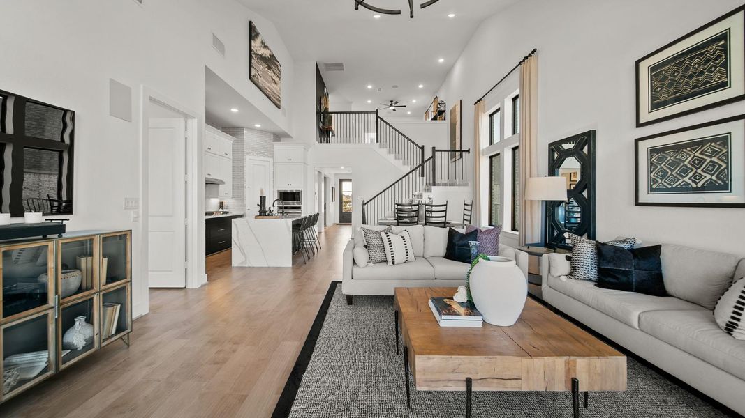 View from the family room shows the main bedroom door located to the left and a marvelous view of the grand staircase! View from the family room shows the main bedroom door located to the left and a marvelous view of the grand staircase!