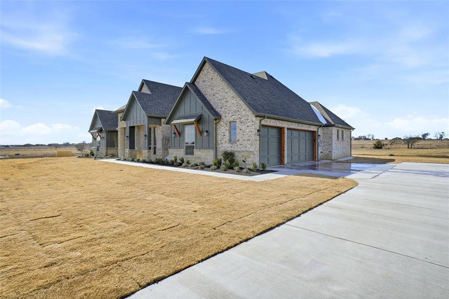 Front exterior of a new home in , Godley, TX, highlighting curb appeal (Image 26).