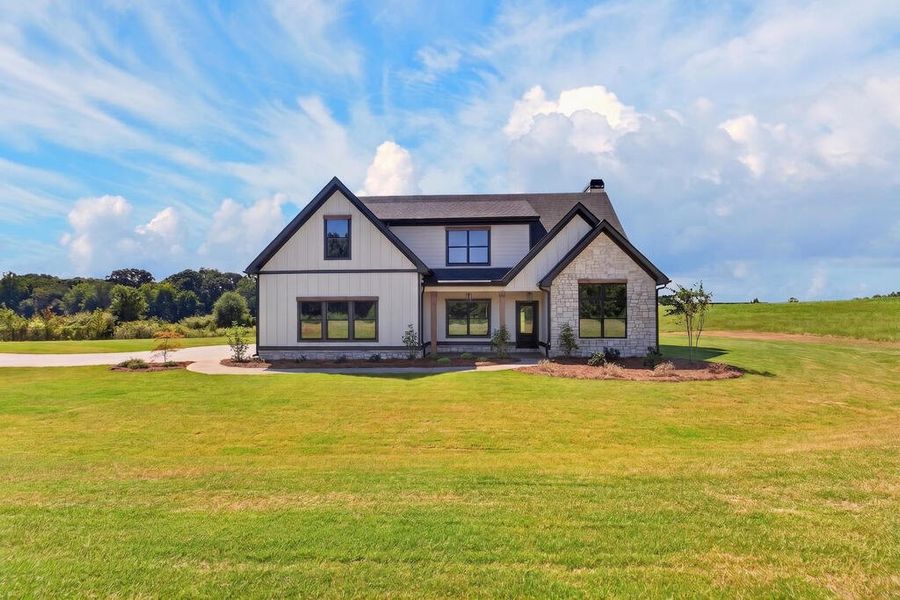 Front exterior of a new home in Veal Meadows, Roopville, GA, highlighting curb appeal (Image 2). Front exterior of a new home in Veal Meadows, Roopville, GA, highlighting curb appeal (Image 2).