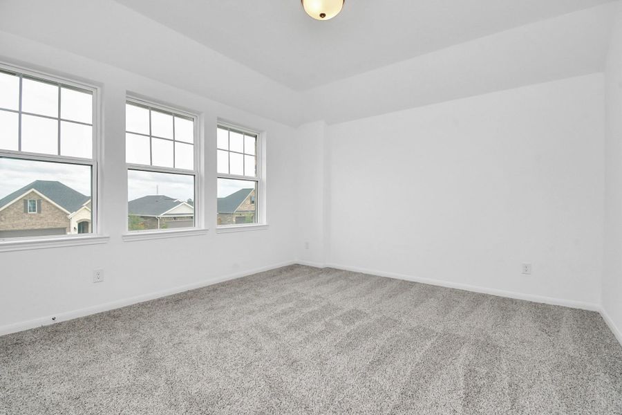 Spacious, unfurnished interior of a new home in Sunterra, Katy (Image 29).