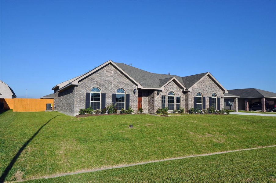 Front exterior of a new home in Pedregal, League City, TX, highlighting curb appeal (Image 22).