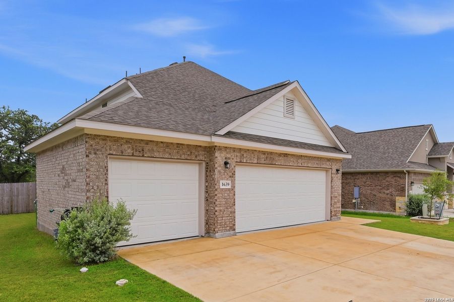 Front exterior of a new home in Ventana, Bulverde, TX, highlighting curb appeal (Image 21).