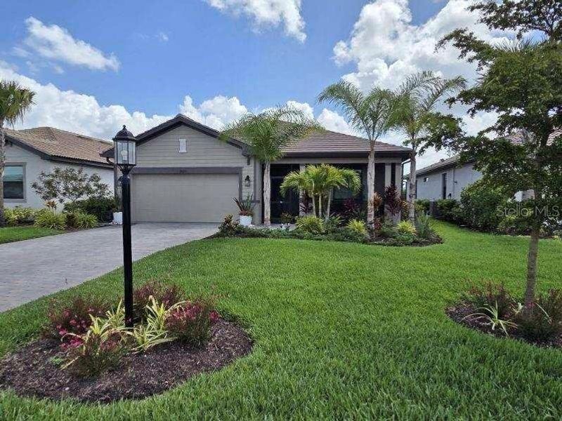 Front exterior of a new home in , Estero, FL, highlighting curb appeal (Image 23).