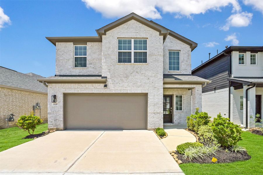 Front exterior of a new home in Saint Tropez, Houston, TX, highlighting curb appeal (Image 2). Front exterior of a new home in Saint Tropez, Houston, TX, highlighting curb appeal (Image 2).