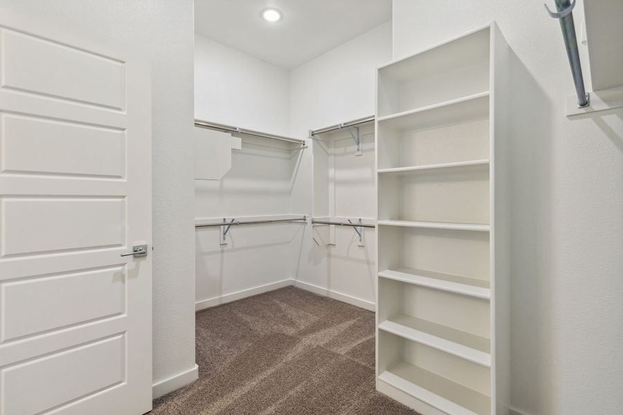 Primary Closet in the Bowie home plan by Trophy Signature Homes – REPRESENTATIVE PHOTO Primary Closet in the Bowie home plan by Trophy Signature Homes – REPRESENTATIVE PHOTO