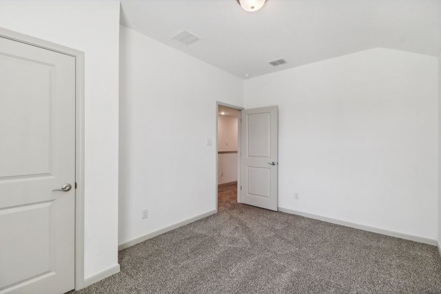 Representative unfurnished interior of a home built from the The Kennedy by Rosehaven Homes in Magnolia Village North, San Antonio (Image 22).
