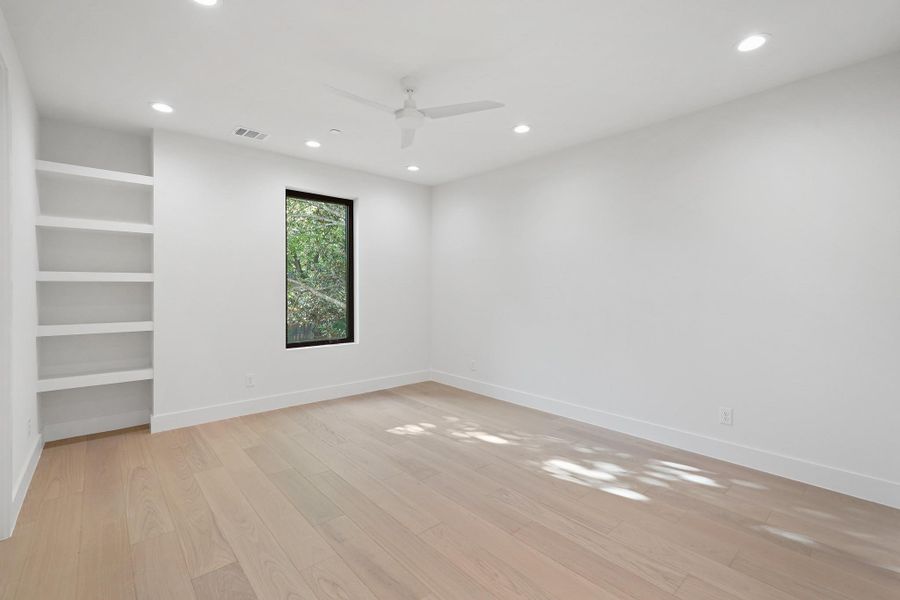 Each of the secondary bedrooms is generously proportioned. This is the west side secondary bedroom.