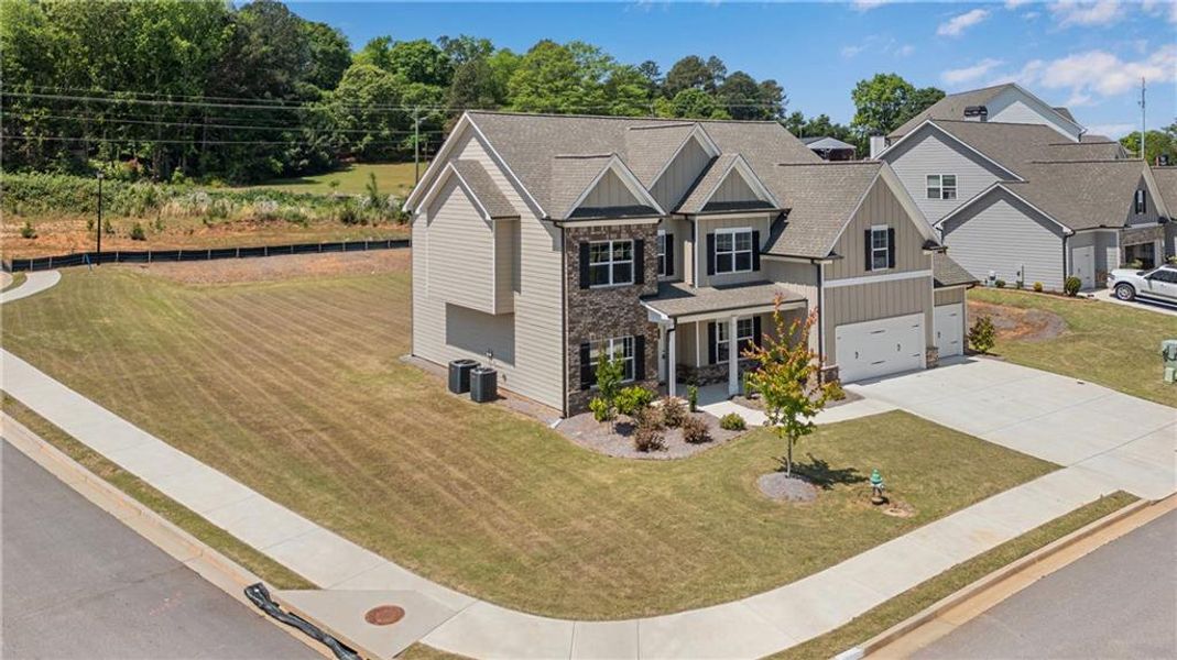 Front exterior of a new home in Hidden Fields, Hoschton, GA, highlighting curb appeal (Image 24).