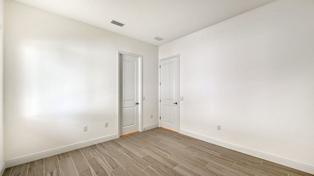 Spacious, unfurnished interior of a new home in Palm Grove Real Estate and Homes for Sale in Lakewood Ranch, FL - Neal Communities, Bradenton (Image 34).