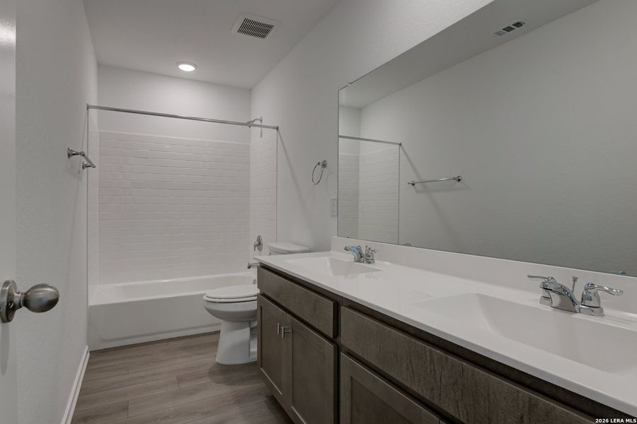 Furnished interior view inside a new home in Hennersby Hollow, San Antonio (Image 6).