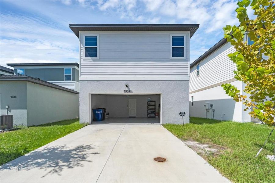 Front exterior of a new home in , St. Cloud, FL, highlighting curb appeal (Image 26).