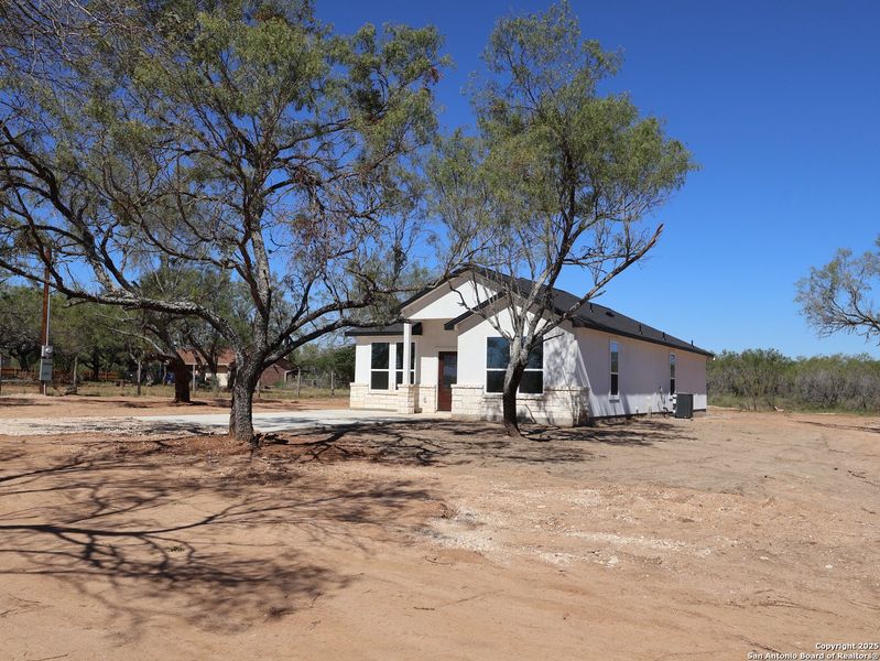 Exterior details and patio area of a home in , Von Ormy (Image 11).