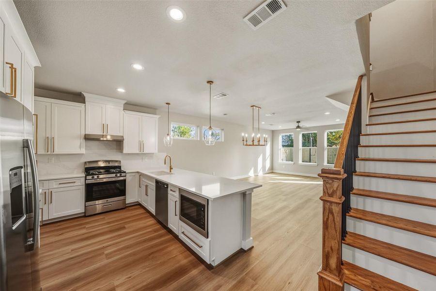 Experience the heart of your dream home with a stunning kitchen that features elegant quartz countertops, top-of-the-line GE appliances, and exquisite lighting fixtures—making it a space you'll never want to leave.