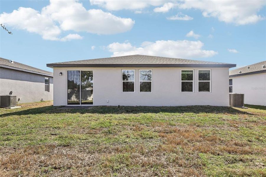 Exterior details and patio area of a home in Bradbury Creek - Signature Series, Haines City (Image 3).