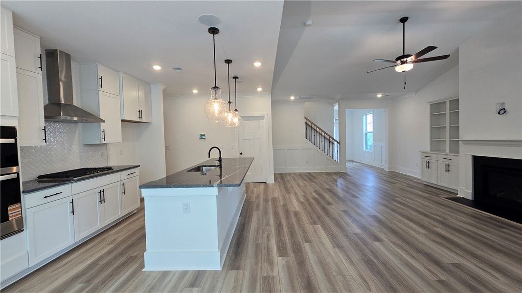An open-concept living space features a contempora