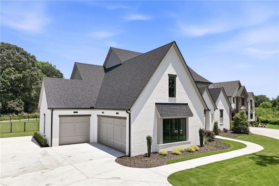 Front exterior of a new home in , Gainesville, GA, highlighting curb appeal (Image 1). Front exterior of a new home in , Gainesville, GA, highlighting curb appeal (Image 1).