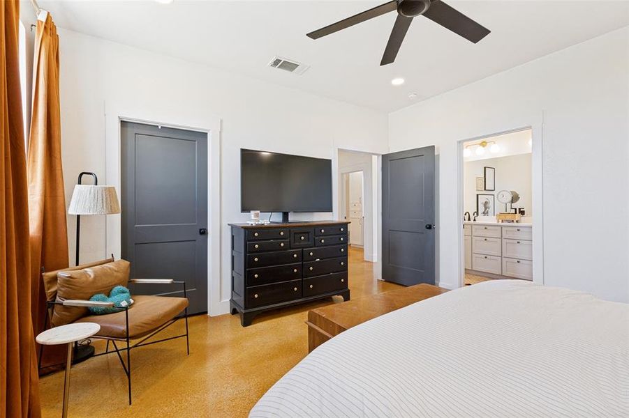 Bedroom featuring a ceiling fan, recessed lighting, and rich wood-finish flooring Bedroom featuring a ceiling fan, recessed lighting, and rich wood-finish flooring